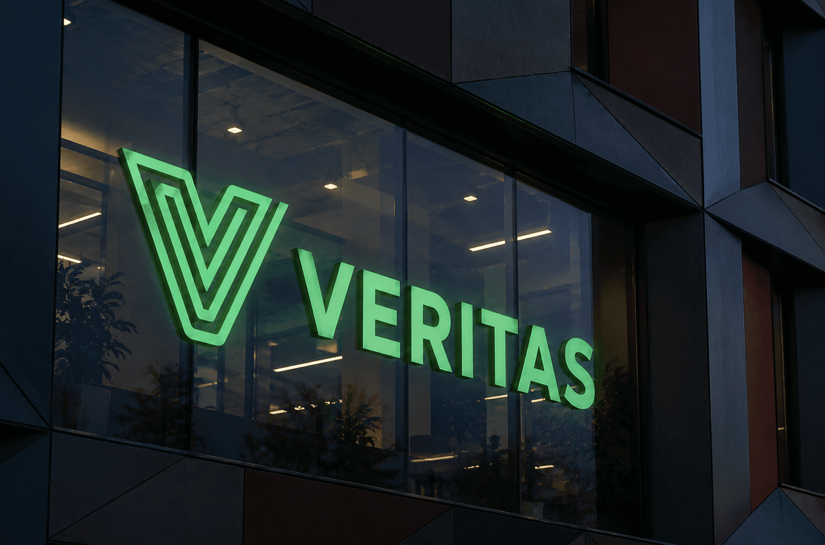 Veritaksen valomainos rakennuksen julkisivussa